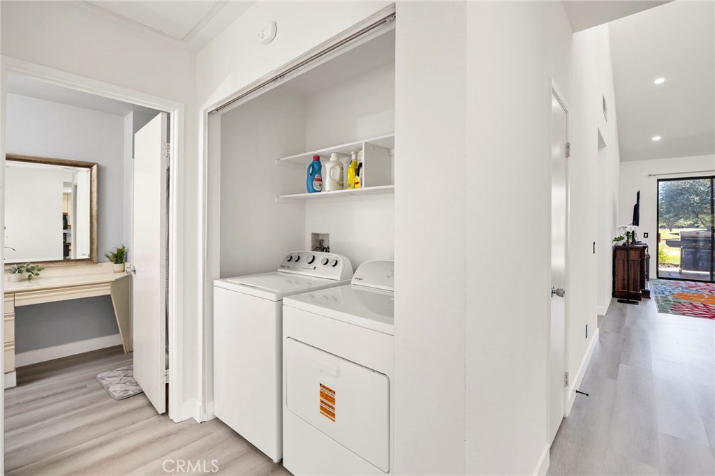 54880 Inverness Way La Quinta, CA 92253 - Photo 26 of 35 a view of a hallway and a livingroom with wooden floor