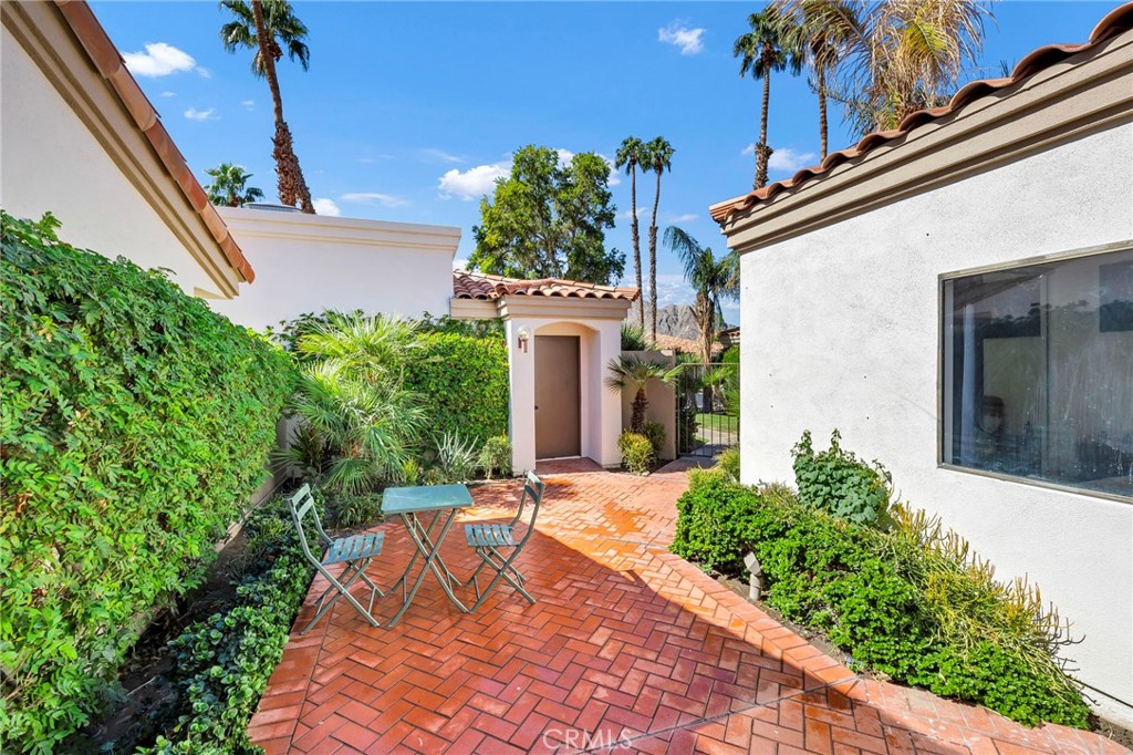 54880 Inverness Way La Quinta, CA 92253 - Photo 4 of 35 a front view of a house with a yard
