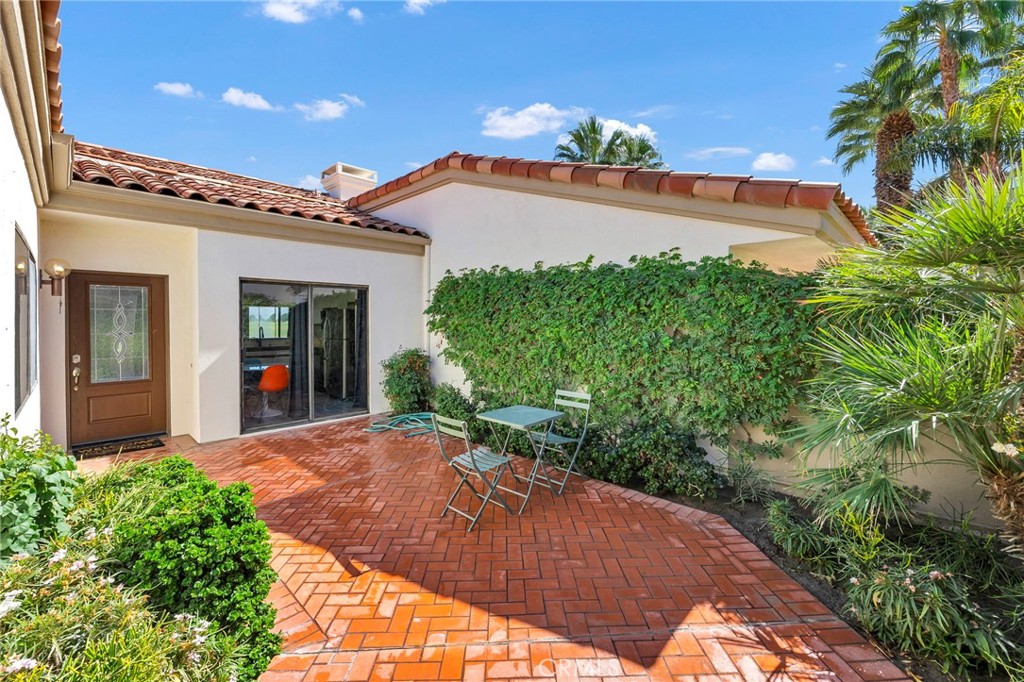 54880 Inverness Way La Quinta, CA 92253 - Photo 5 of 35 a view of a house with a yard and potted plants