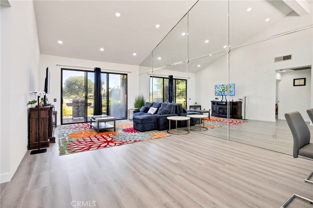54880 Inverness Way La Quinta, CA 92253 - Photo 7 of 35 a living room with furniture window and flat screen tv