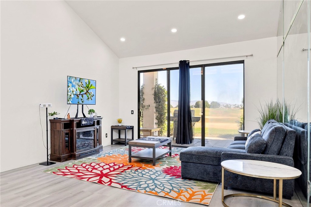 54880 Inverness Way La Quinta, CA 92253 - Photo 10 of 35 a living room with furniture and a large window