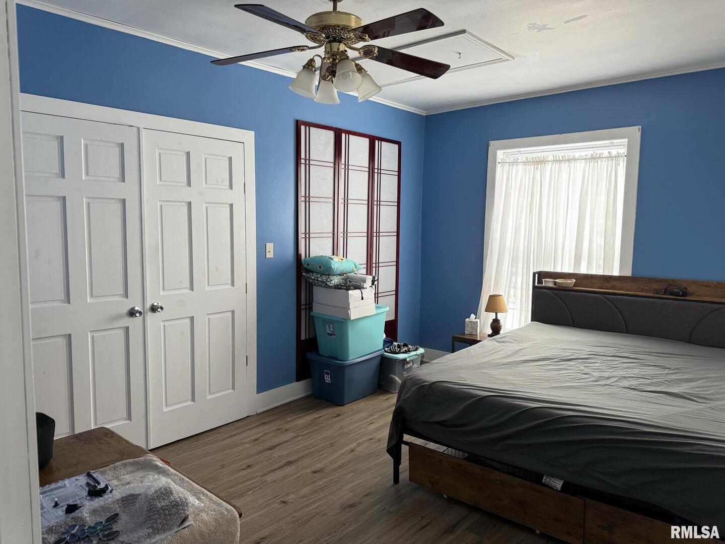 809 South Commercial Street Benton, IL 62812 - Photo 13 of 20 a bedroom with a large bed chandelier and a window