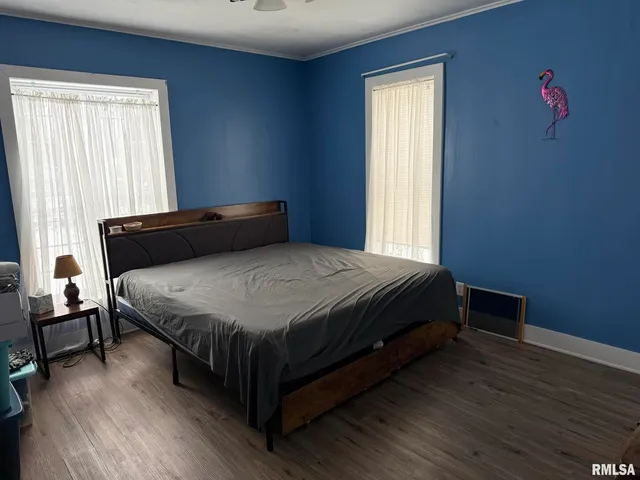 a bedroom with a bed and window