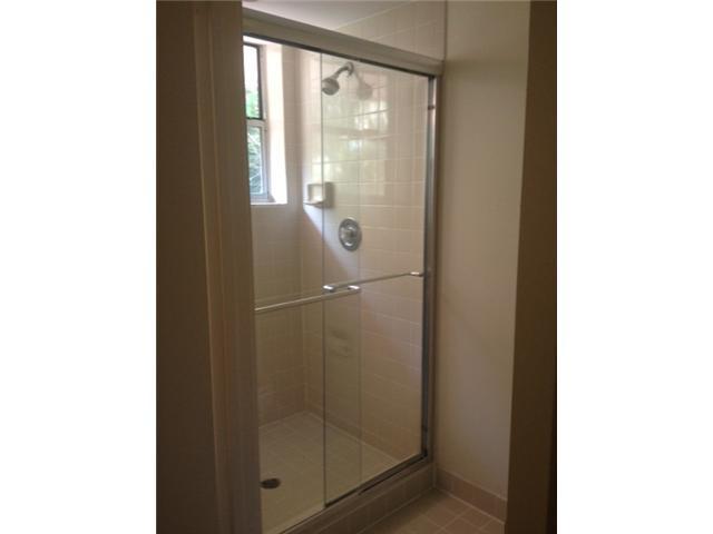 2186 Northwest 52nd Street Boca Raton, FL 33496 - Photo 14 of 23 a bathroom with a glass shower door