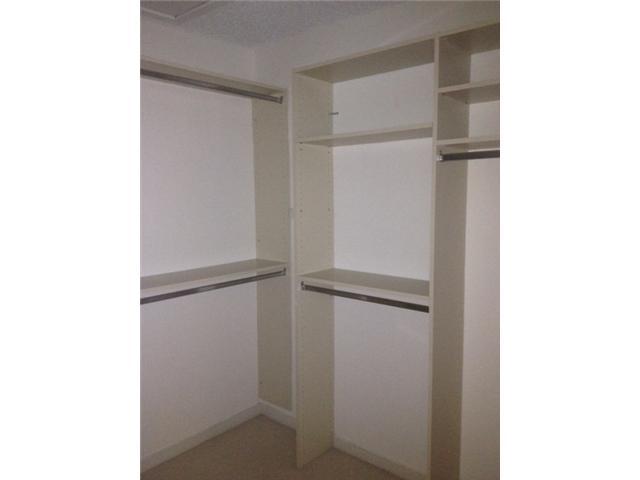 2186 Northwest 52nd Street Boca Raton, FL 33496 - Photo 15 of 23 a view of walk in closet with empty racks