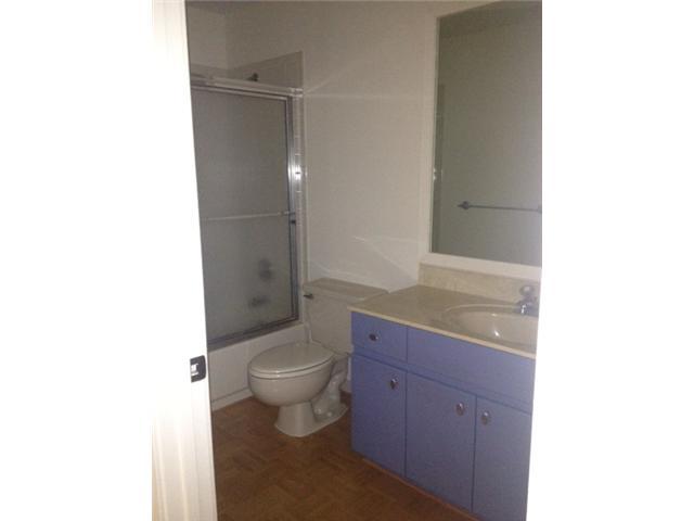 2186 Northwest 52nd Street Boca Raton, FL 33496 - Photo 18 of 23 a bathroom with a granite countertop toilet a sink and a mirror