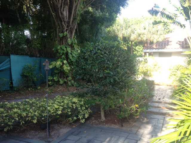 2186 Northwest 52nd Street Boca Raton, FL 33496 - Photo 23 of 23 a backyard of a house with lots of green space