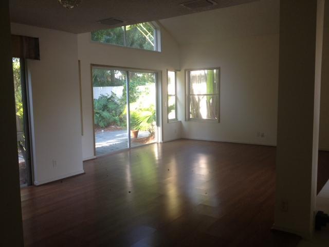 2186 Northwest 52nd Street Boca Raton, FL 33496 - Photo 4 of 23 an empty room with wooden floor and windows