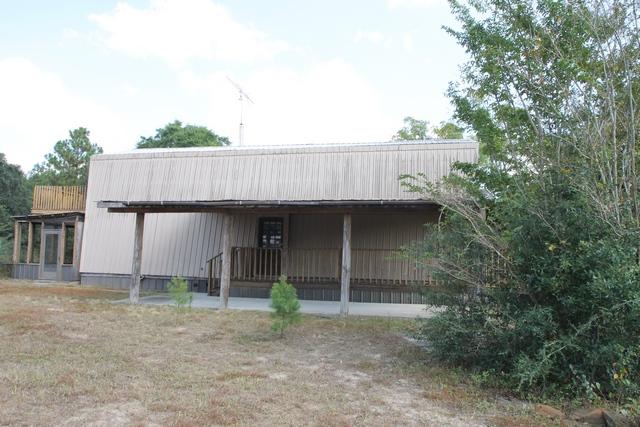 4189 Painter Branch Road Crestview, FL 32539 - Photo 10 of 35 a front view of a house with garden