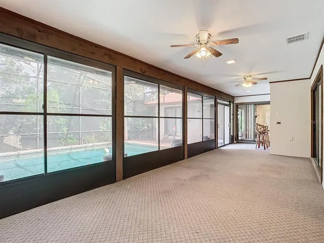 a view of a swimming pool with a patio