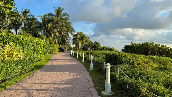 a view of a pathway with a park