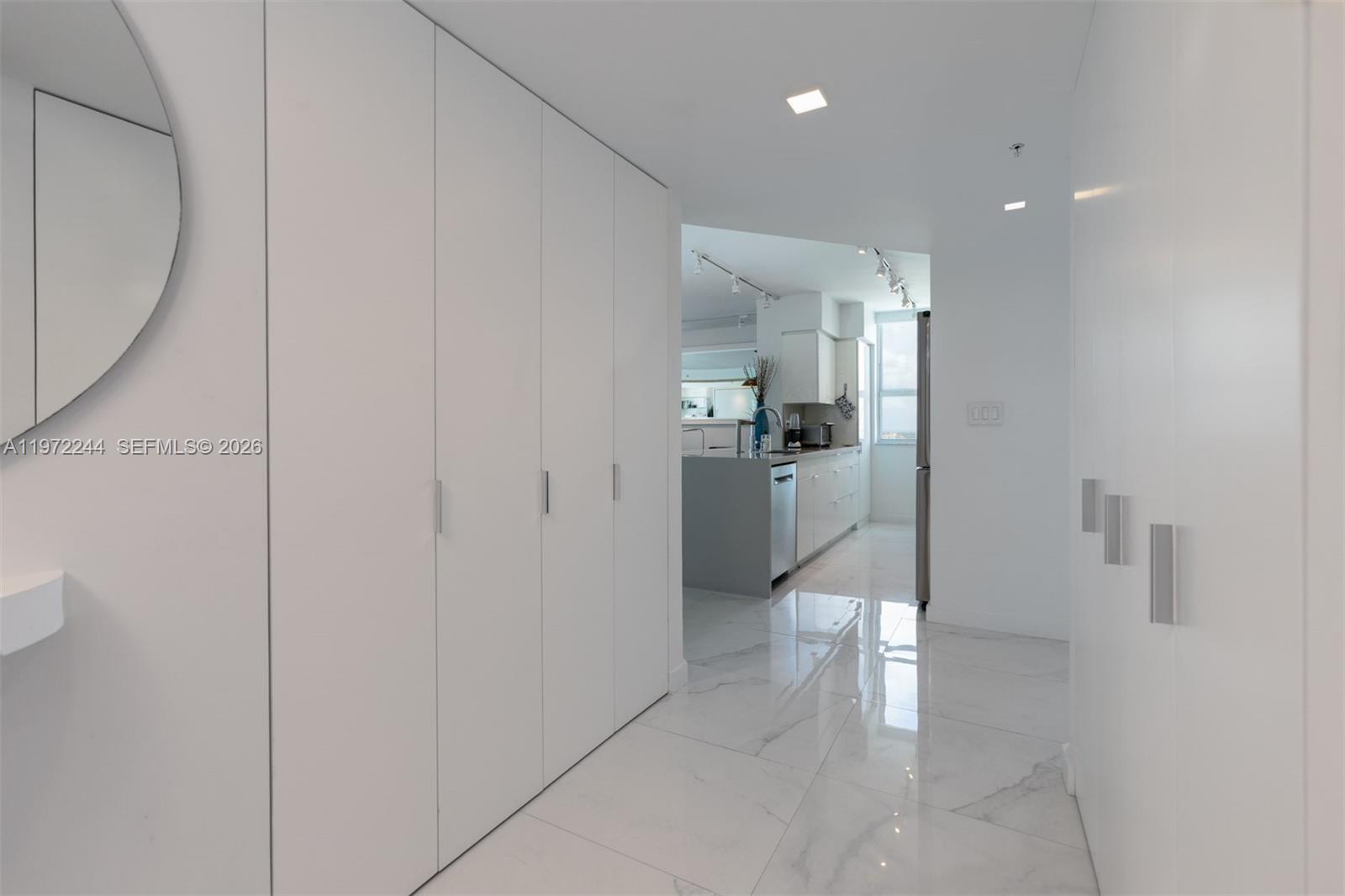 90 Alton Road, Unit 1702 Miami Beach, FL 33139 - Photo 8 of 49 a view of a living room with a sink