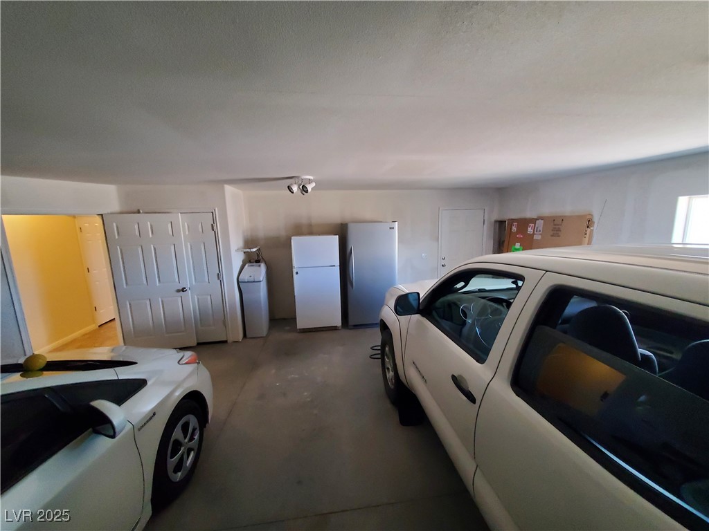 5272 Truman Lane Caliente, NV 89008 - Photo 25 of 39 Garage with freestanding refrigerator and washing machine and dryer