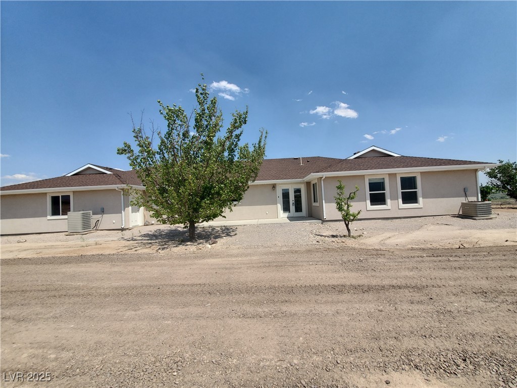 5272 Truman Lane Caliente, NV 89008 - Photo 28 of 39 View of front facade with french doors and stucco siding