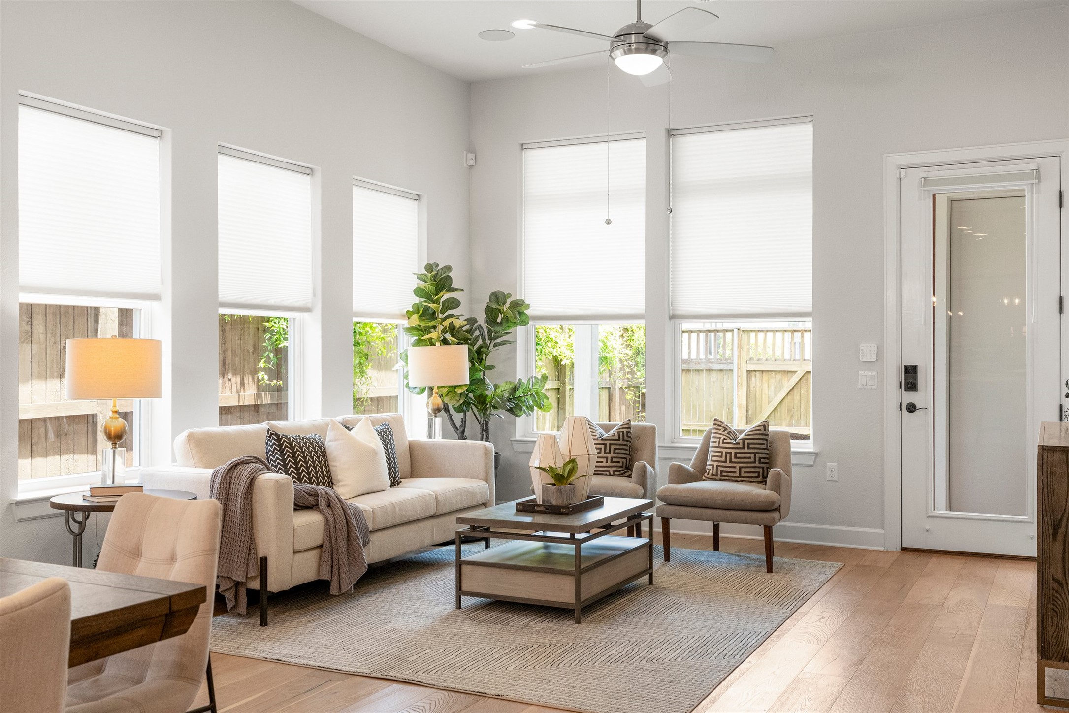 4313 Vaughan Street Austin, TX 78723 - Photo 17 of 39 Large windows flood this inviting living room with natural light, making it a comfortable spot to unwind with a book or host friends for the weekend
