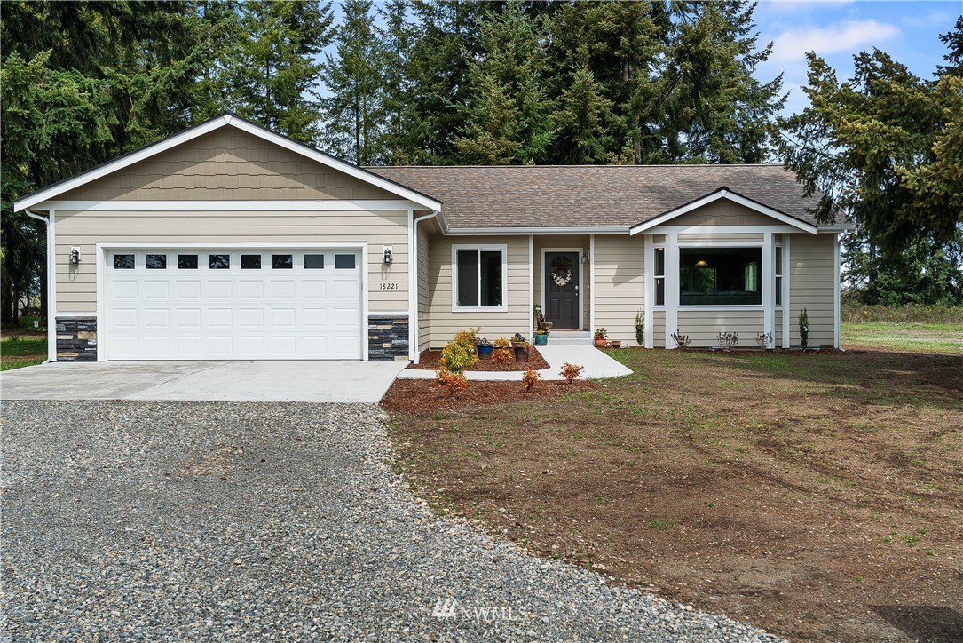 18221 Lawton Lane Southwest Rochester, WA 98579 - Photo 1 of 36 a front view of a house with yard