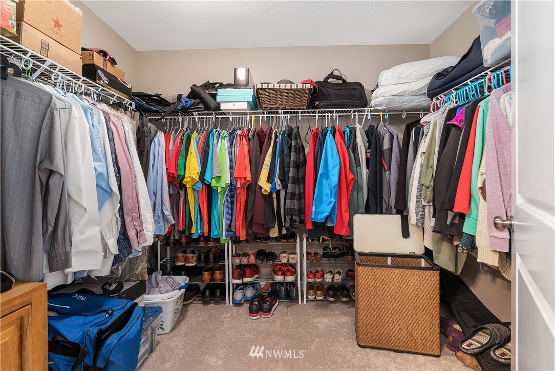 18221 Lawton Lane Southwest Rochester, WA 98579 - Photo 21 of 36 a view of walk in closet with clothes and shoes
