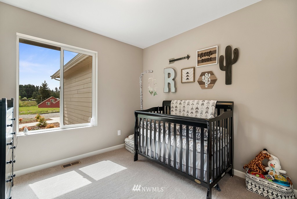 18221 Lawton Lane Southwest Rochester, WA 98579 - Photo 22 of 36 a view of an empty room with a window and shelf
