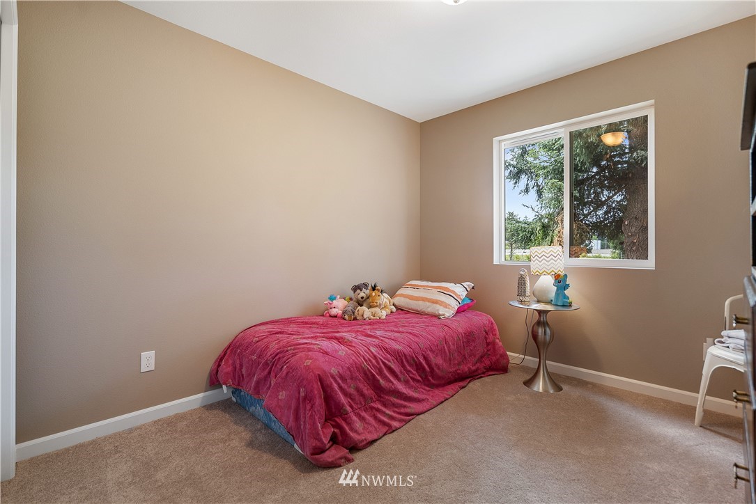 18221 Lawton Lane Southwest Rochester, WA 98579 - Photo 23 of 36 a bed sitting in a bedroom next to a window