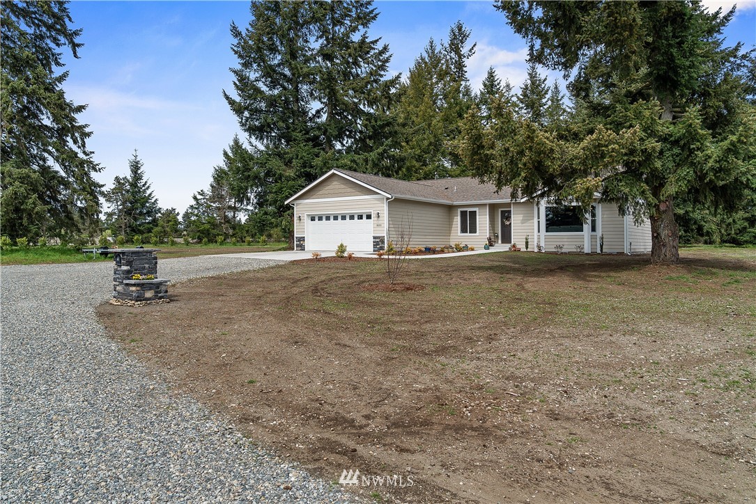 18221 Lawton Lane Southwest Rochester, WA 98579 - Photo 36 of 36 a view of a house with a backyard