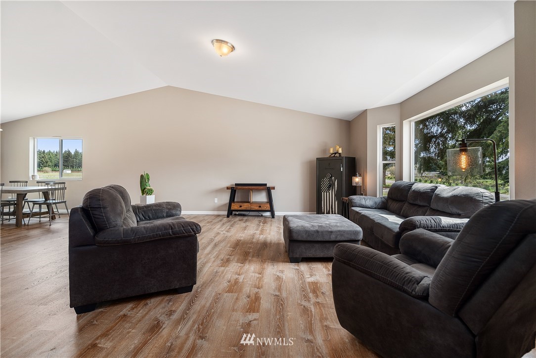 18221 Lawton Lane Southwest Rochester, WA 98579 - Photo 7 of 36 a living room with furniture and a large window