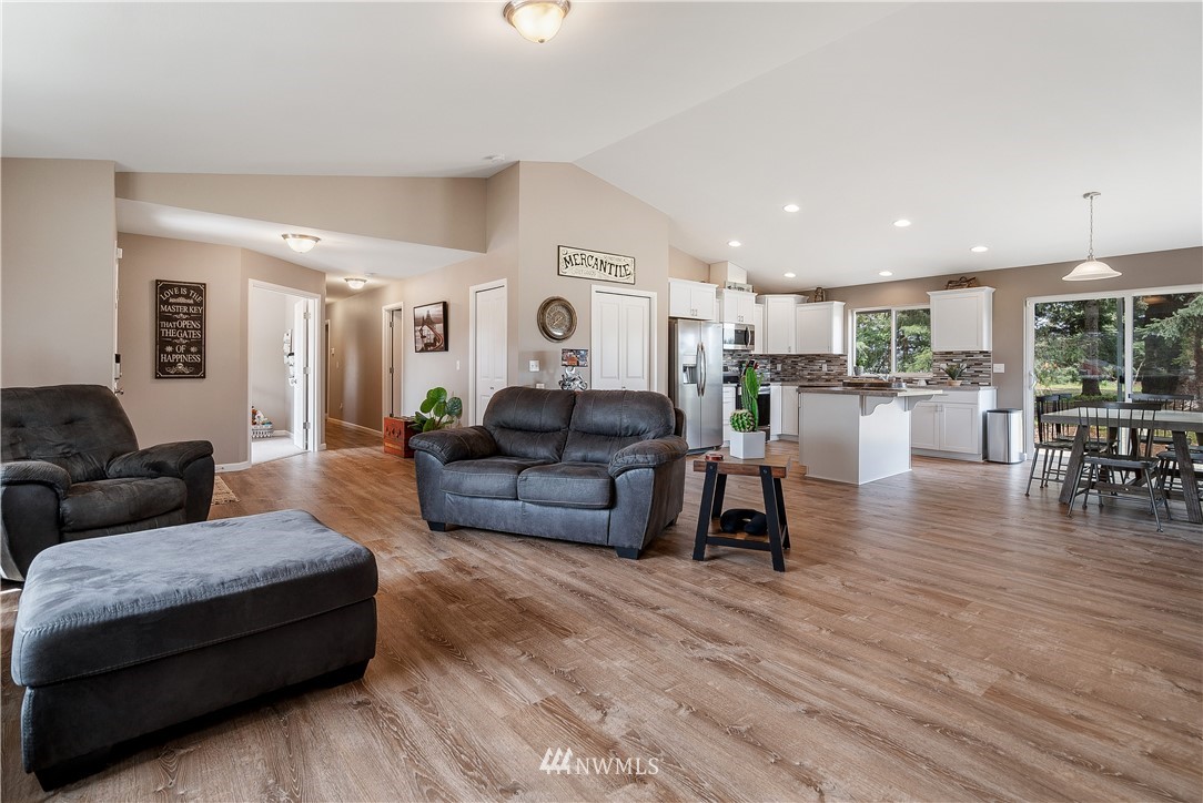 18221 Lawton Lane Southwest Rochester, WA 98579 - Photo 9 of 36 a living room with furniture and a wooden floor