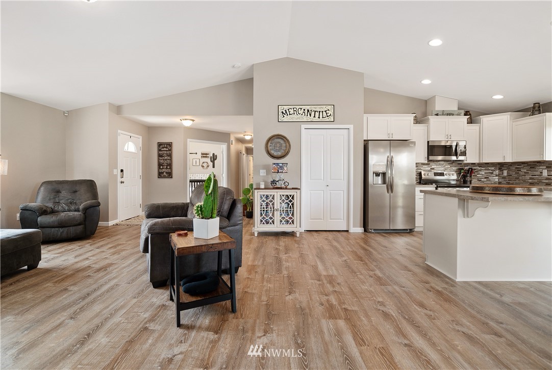 18221 Lawton Lane Southwest Rochester, WA 98579 - Photo 10 of 36 a living room with furniture and a wooden floor