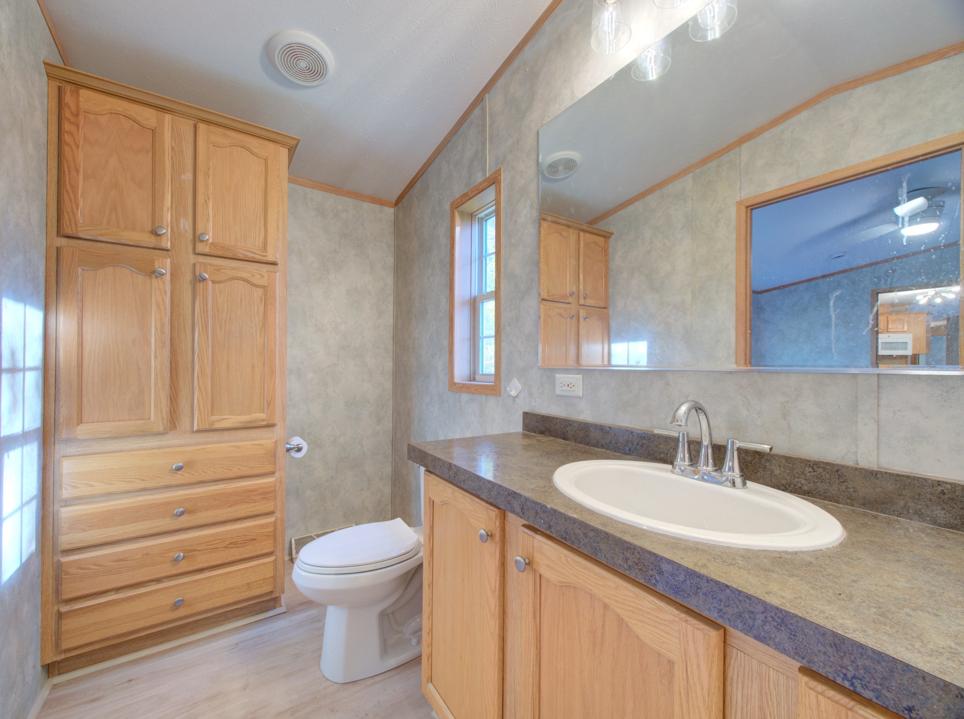 932 Long Cove Road Ledyard, CT 06335 - Photo 15 of 34 a bathroom with a sink a toilet and tub
