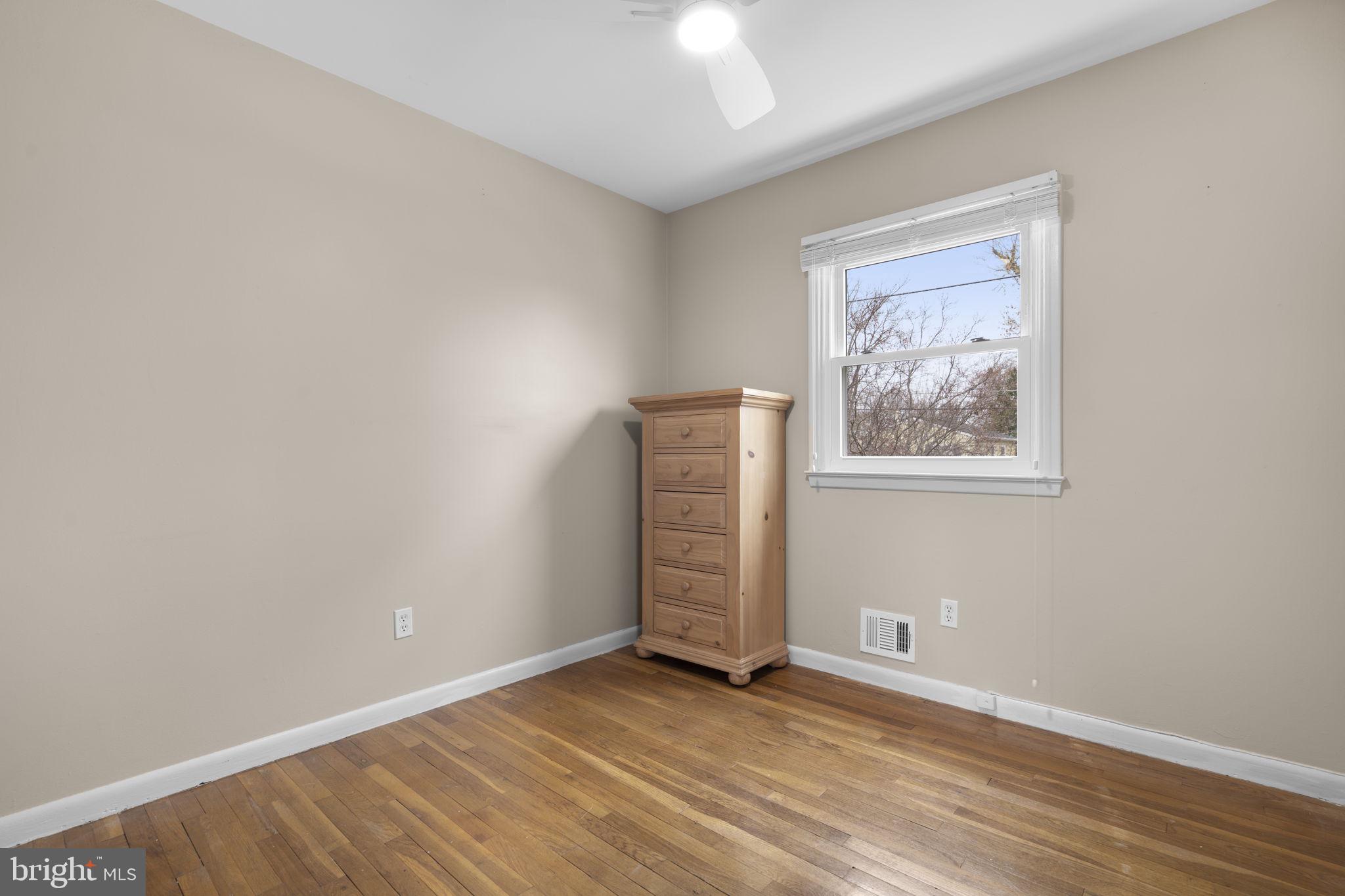 3008 Hardy Avenue Silver Spring, MD 20902 - Photo 19 of 29 an empty room with wooden floor closet and windows