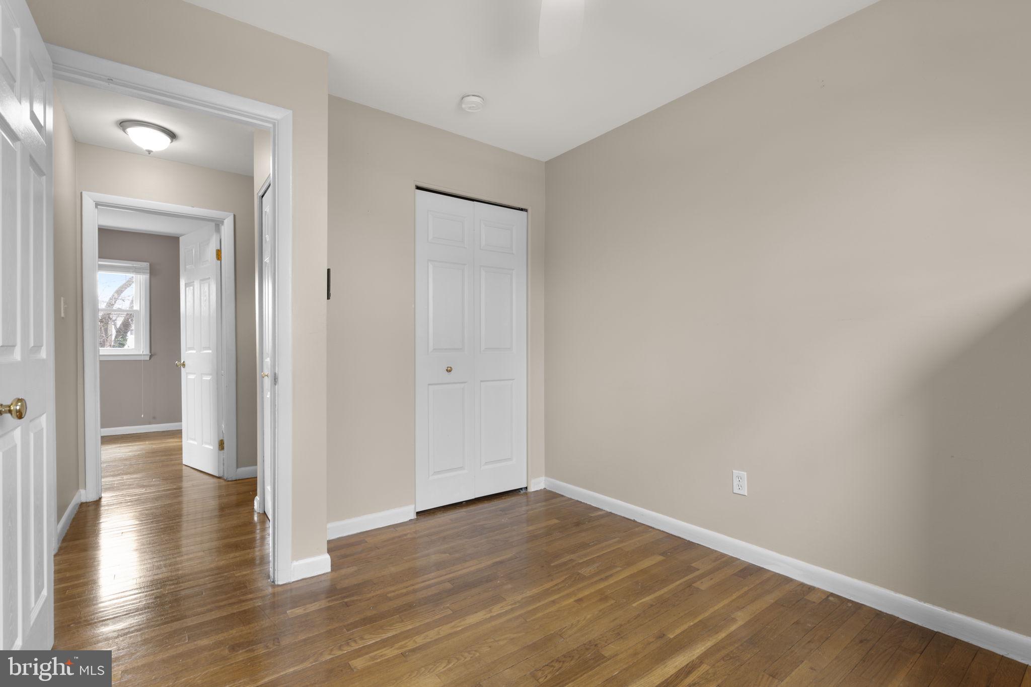 3008 Hardy Avenue Silver Spring, MD 20902 - Photo 20 of 29 wooden floor in a hall with an empty room