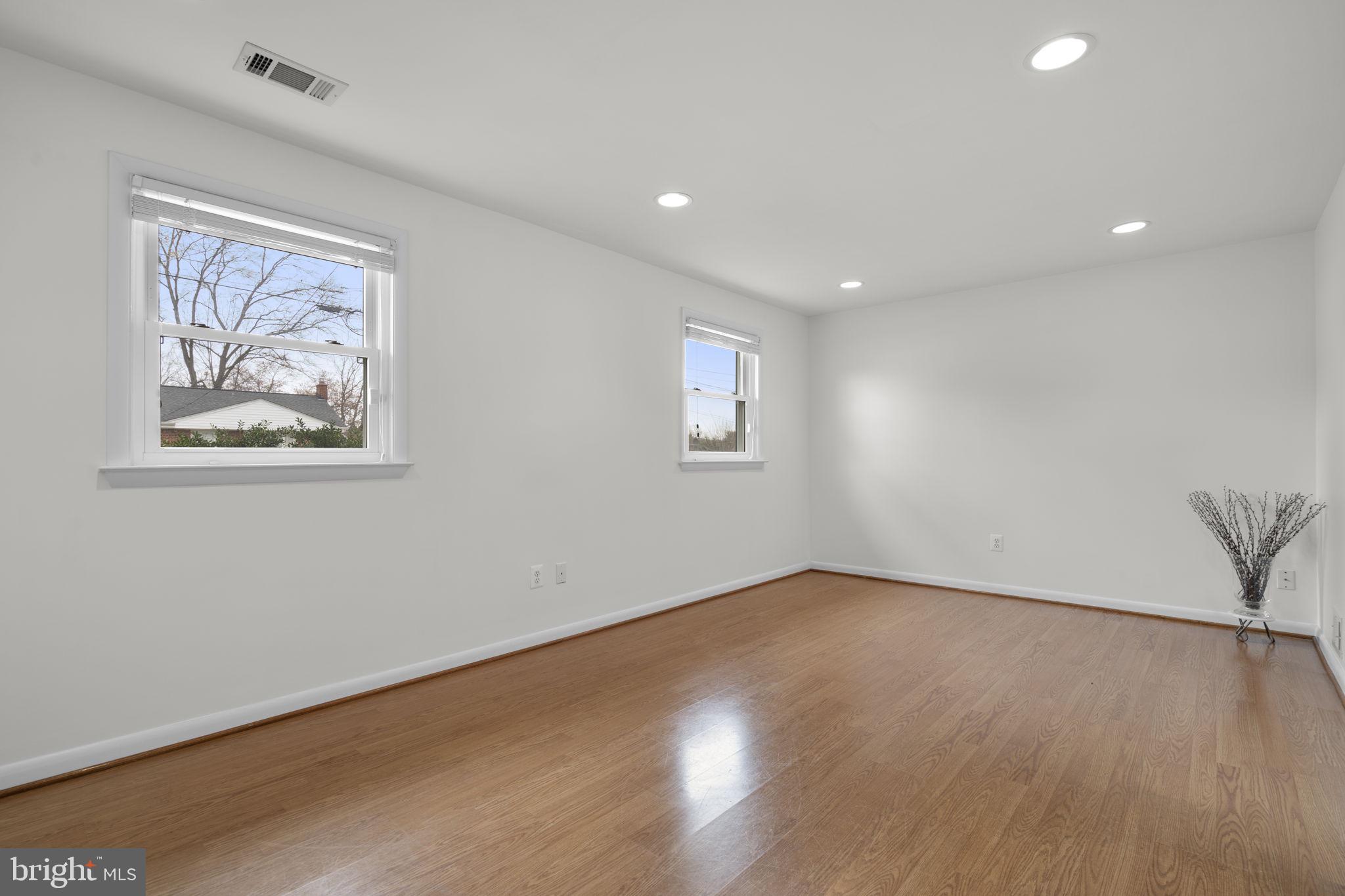 3008 Hardy Avenue Silver Spring, MD 20902 - Photo 21 of 29 a view of an empty room with wooden floor and a window