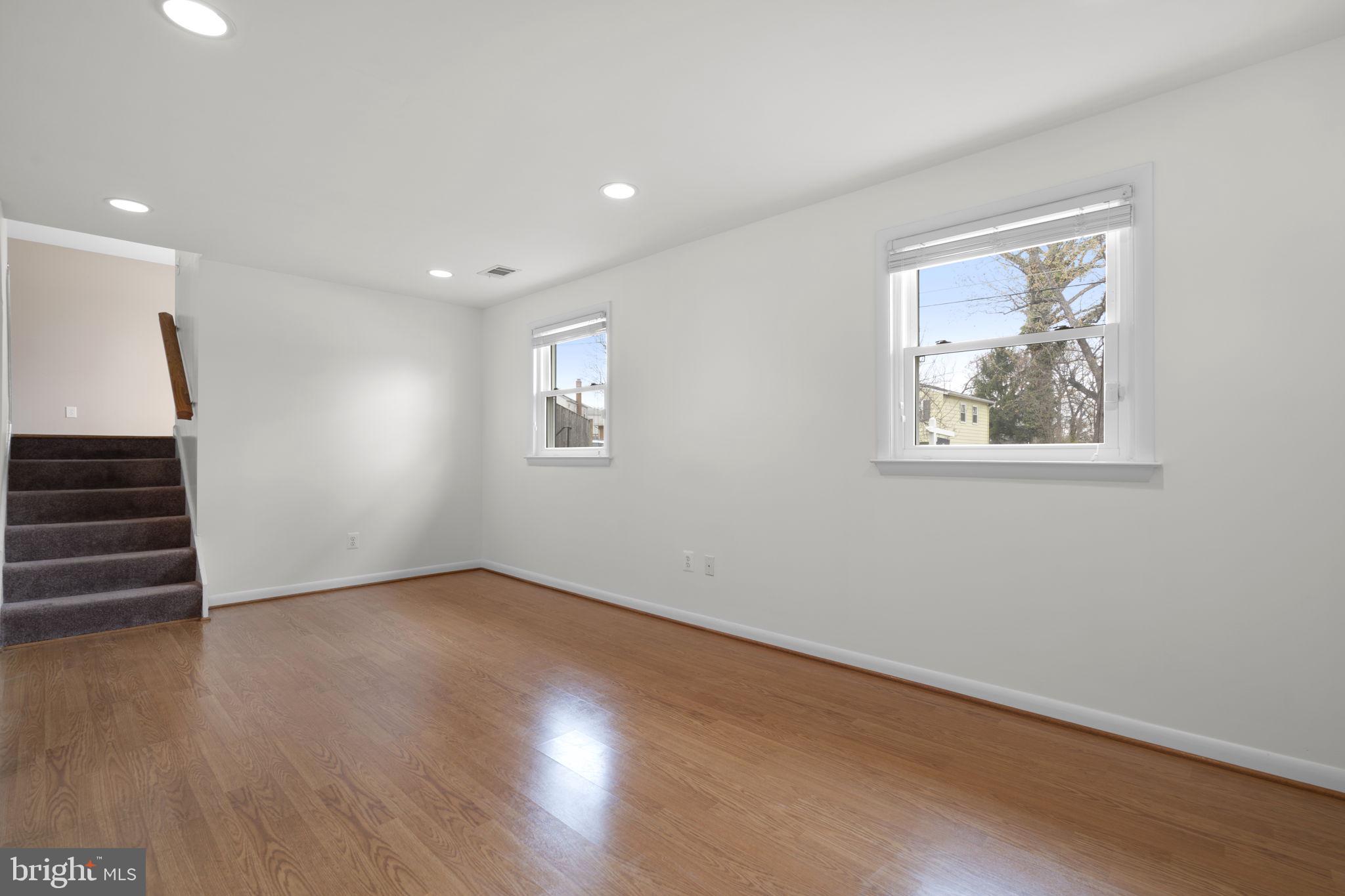 3008 Hardy Avenue Silver Spring, MD 20902 - Photo 22 of 29 a view of an empty room with wooden floor and a window
