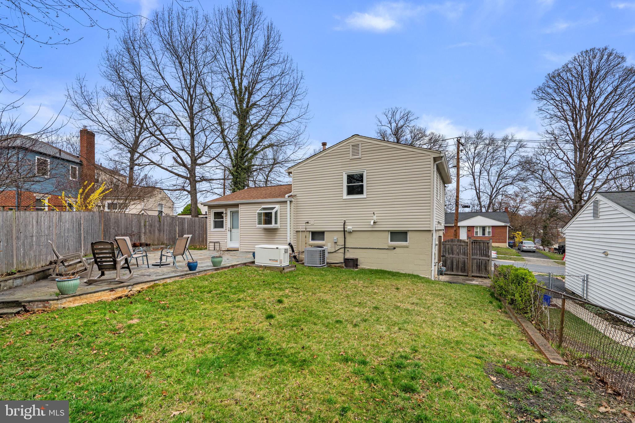 3008 Hardy Avenue Silver Spring, MD 20902 - Photo 28 of 29 a front view of a house with a yard patio and fire pit