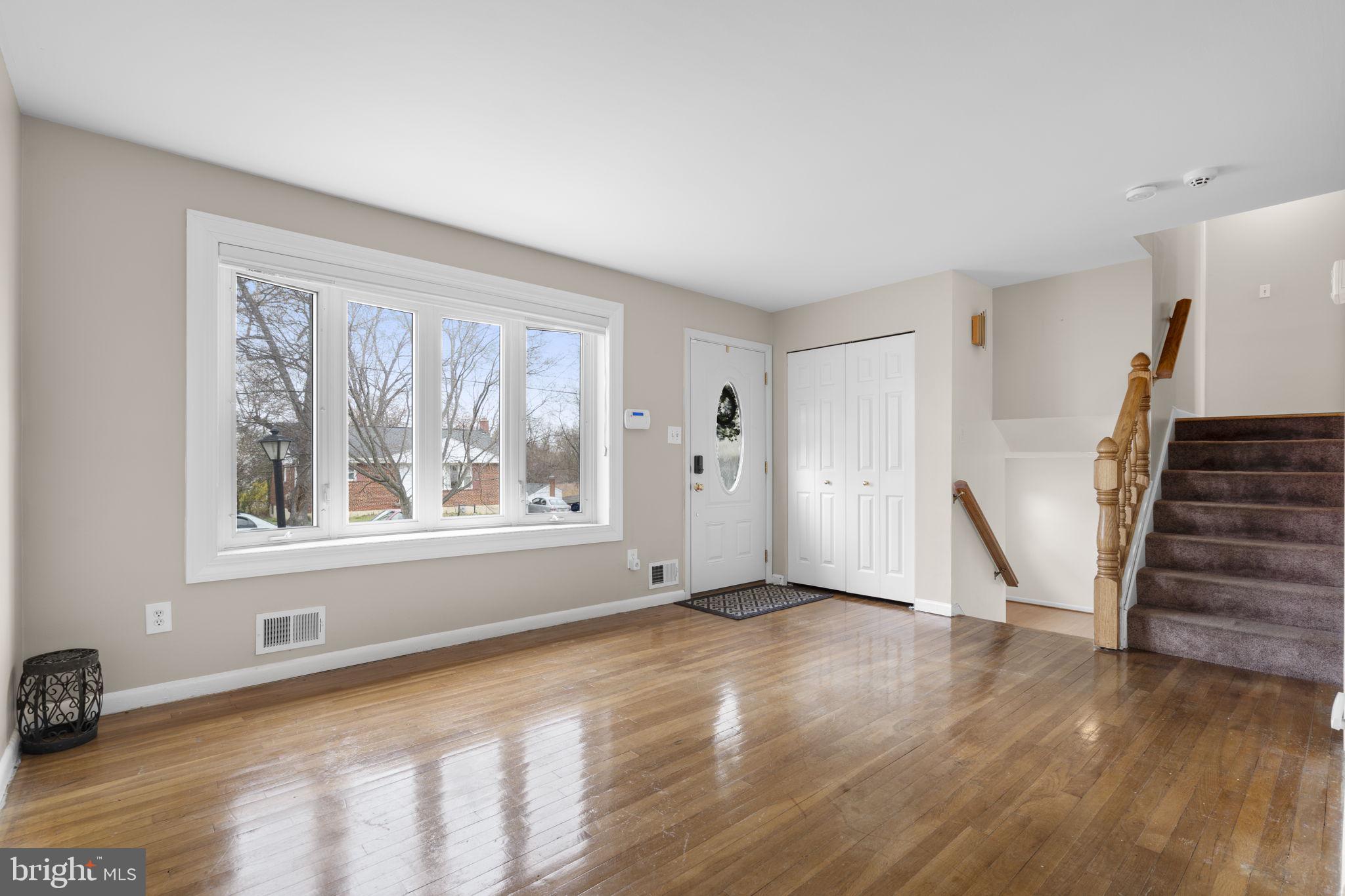 3008 Hardy Avenue Silver Spring, MD 20902 - Photo 5 of 29 a view of an empty room with wooden floor and a window
