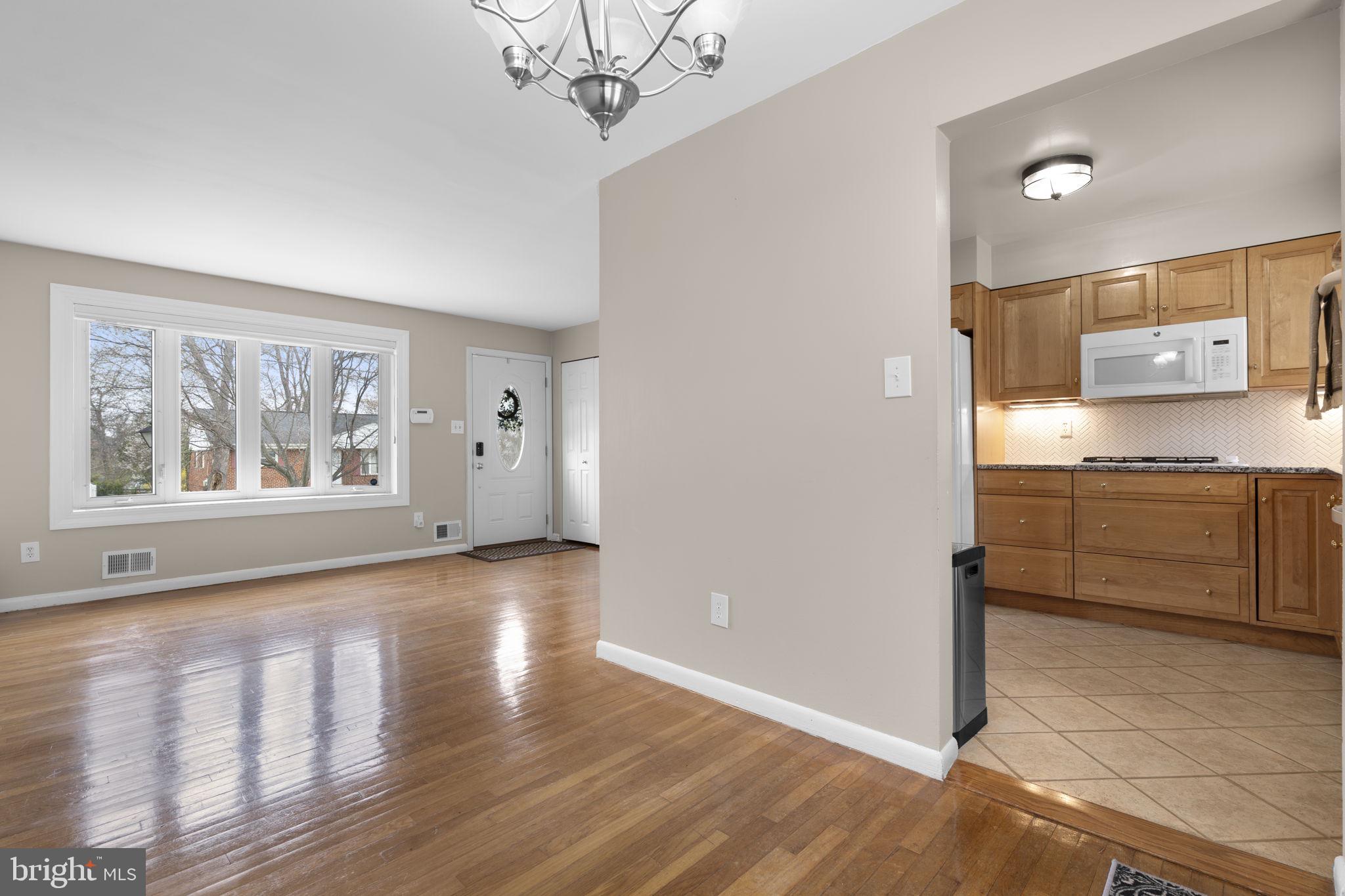 3008 Hardy Avenue Silver Spring, MD 20902 - Photo 8 of 29 a view of a kitchen with an entryway and a window