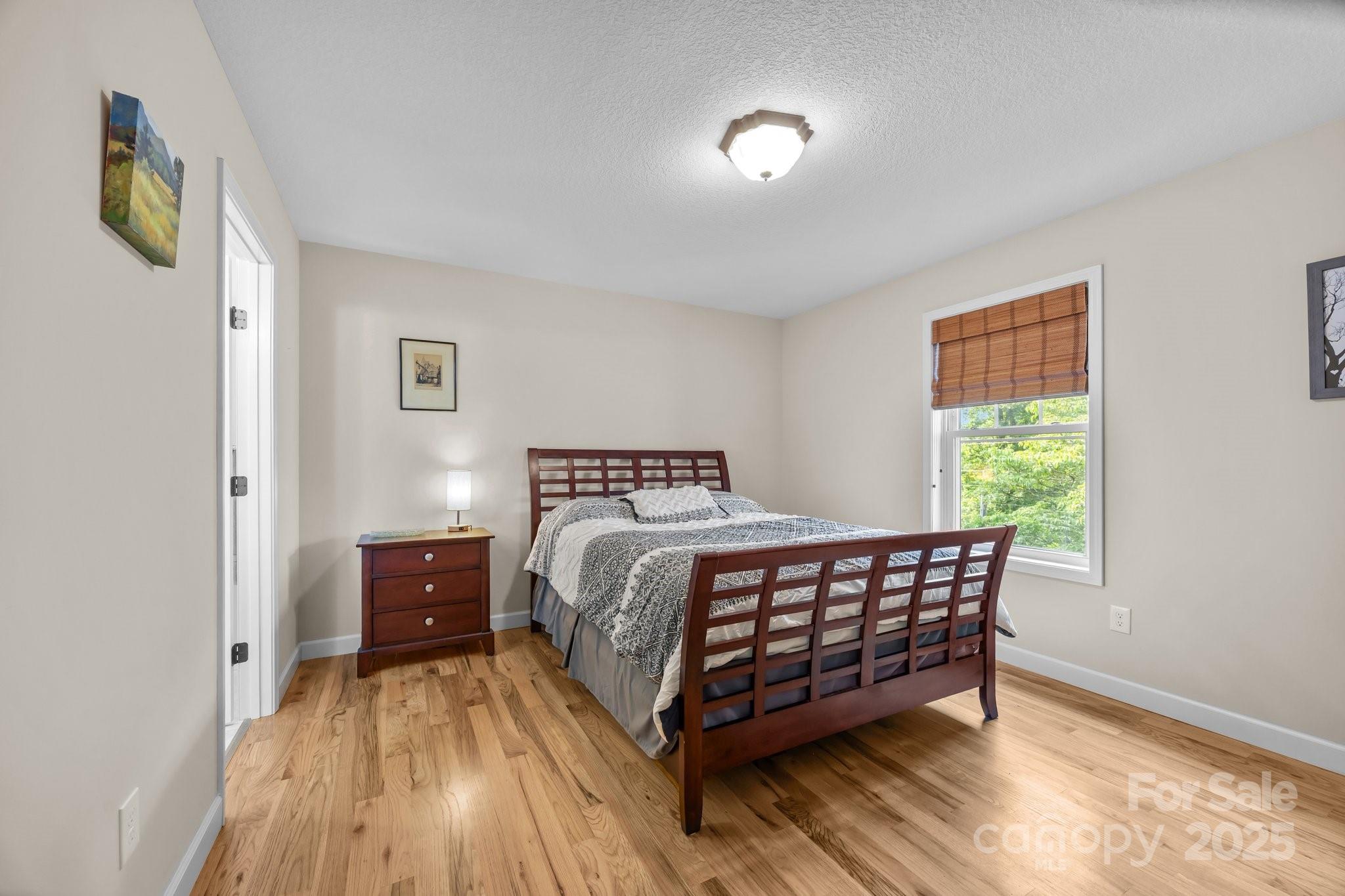 17 Laurel Road Arden, NC 28704 - Photo 15 of 45 a bed room with a bed and a window
