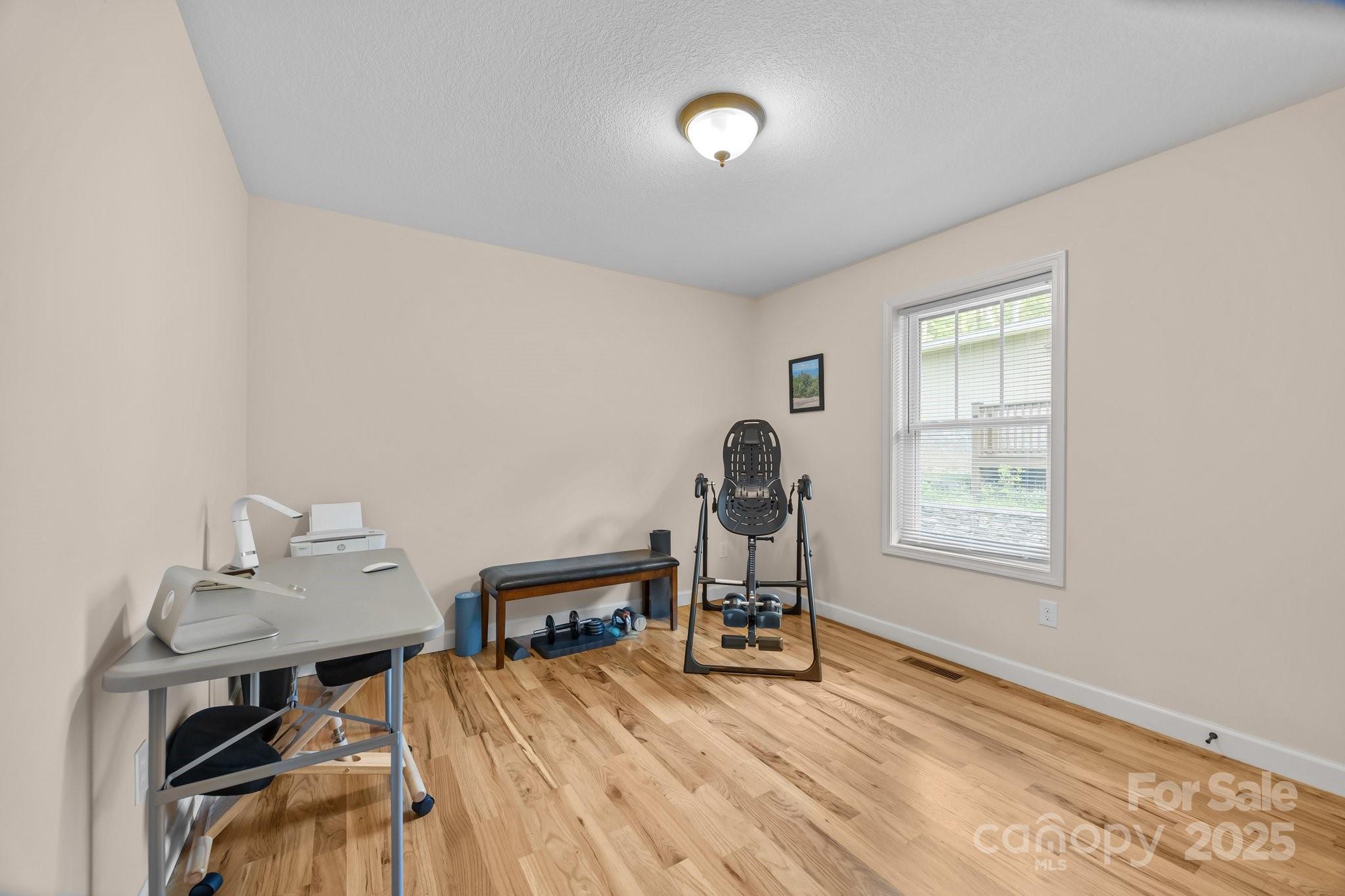 17 Laurel Road Arden, NC 28704 - Photo 20 of 45 a view of a workspace with furniture and a window