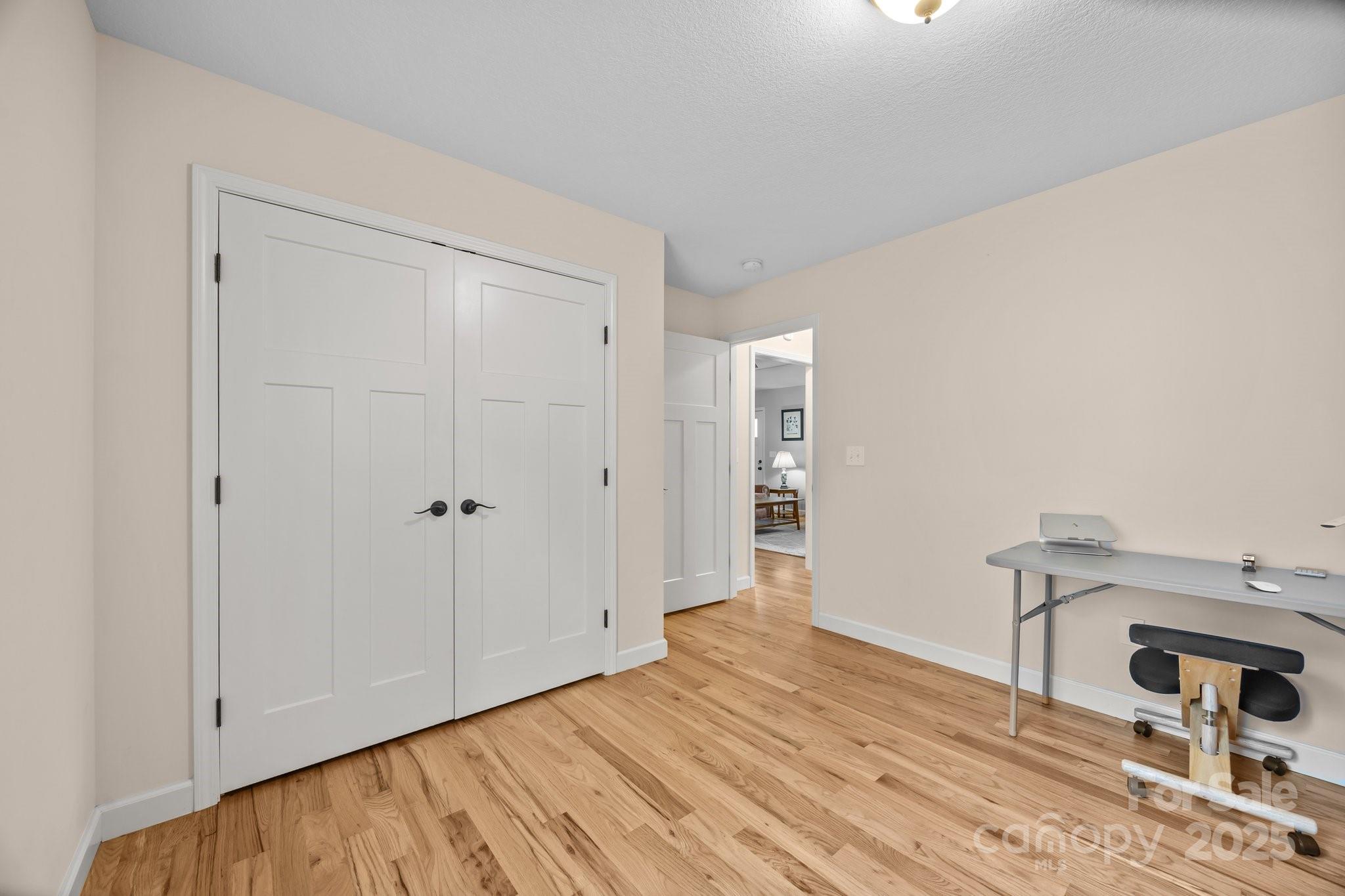 17 Laurel Road Arden, NC 28704 - Photo 21 of 45 a view of a livingroom with wooden floor and closet