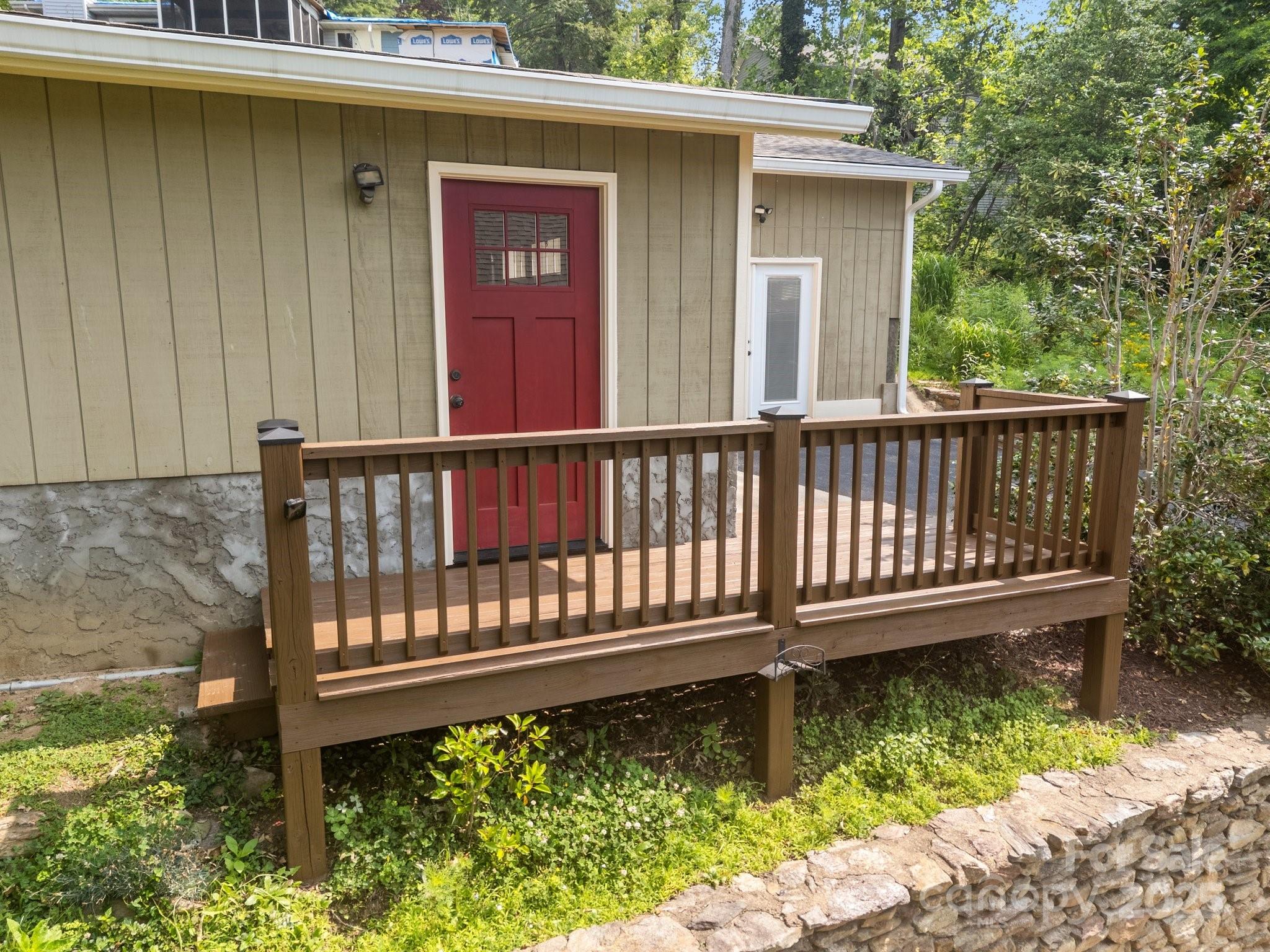 17 Laurel Road Arden, NC 28704 - Photo 31 of 45 a view of a wooden deck with a yard