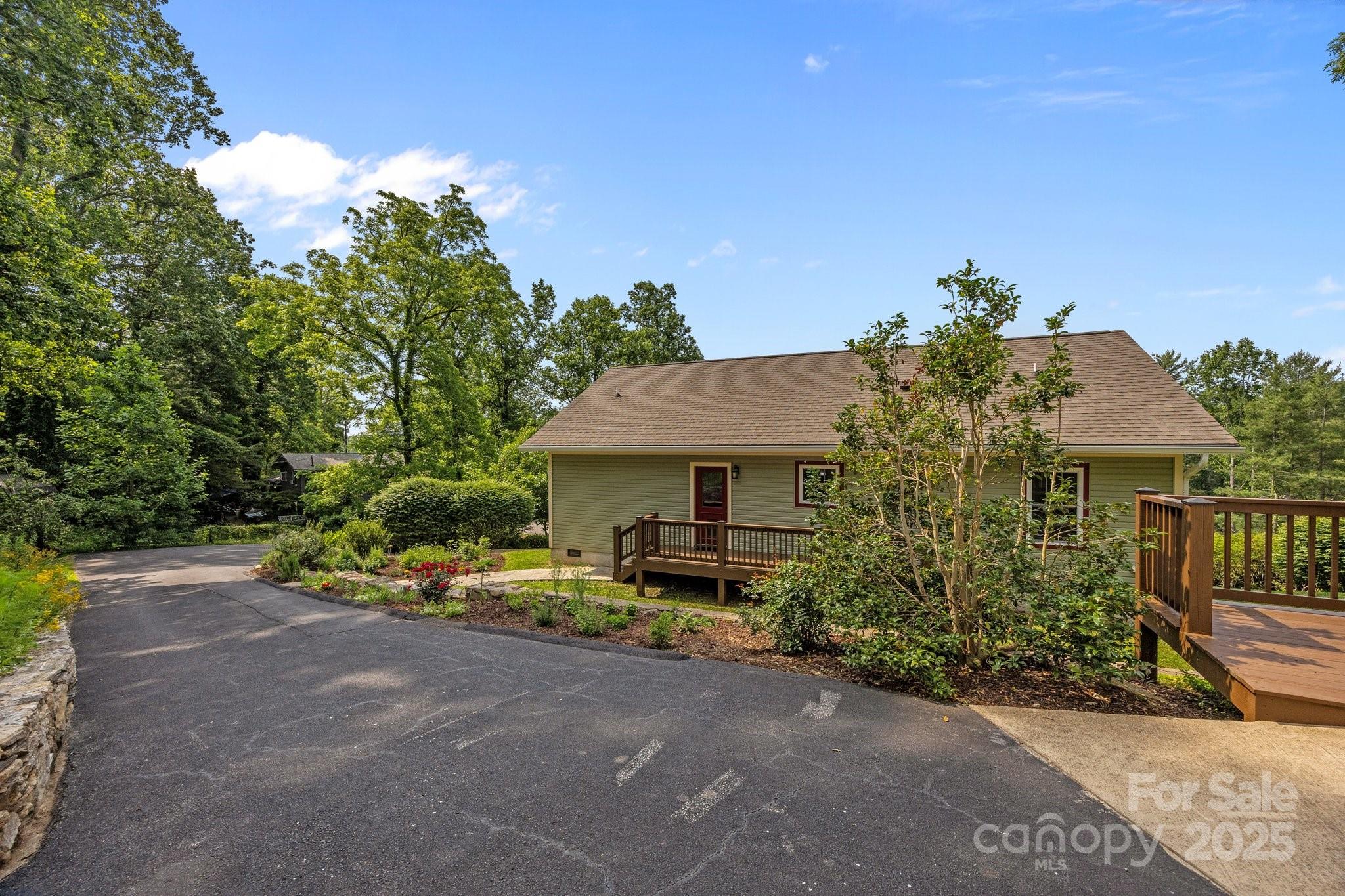 17 Laurel Road Arden, NC 28704 - Photo 32 of 45 a view of a house with a garden and pathway