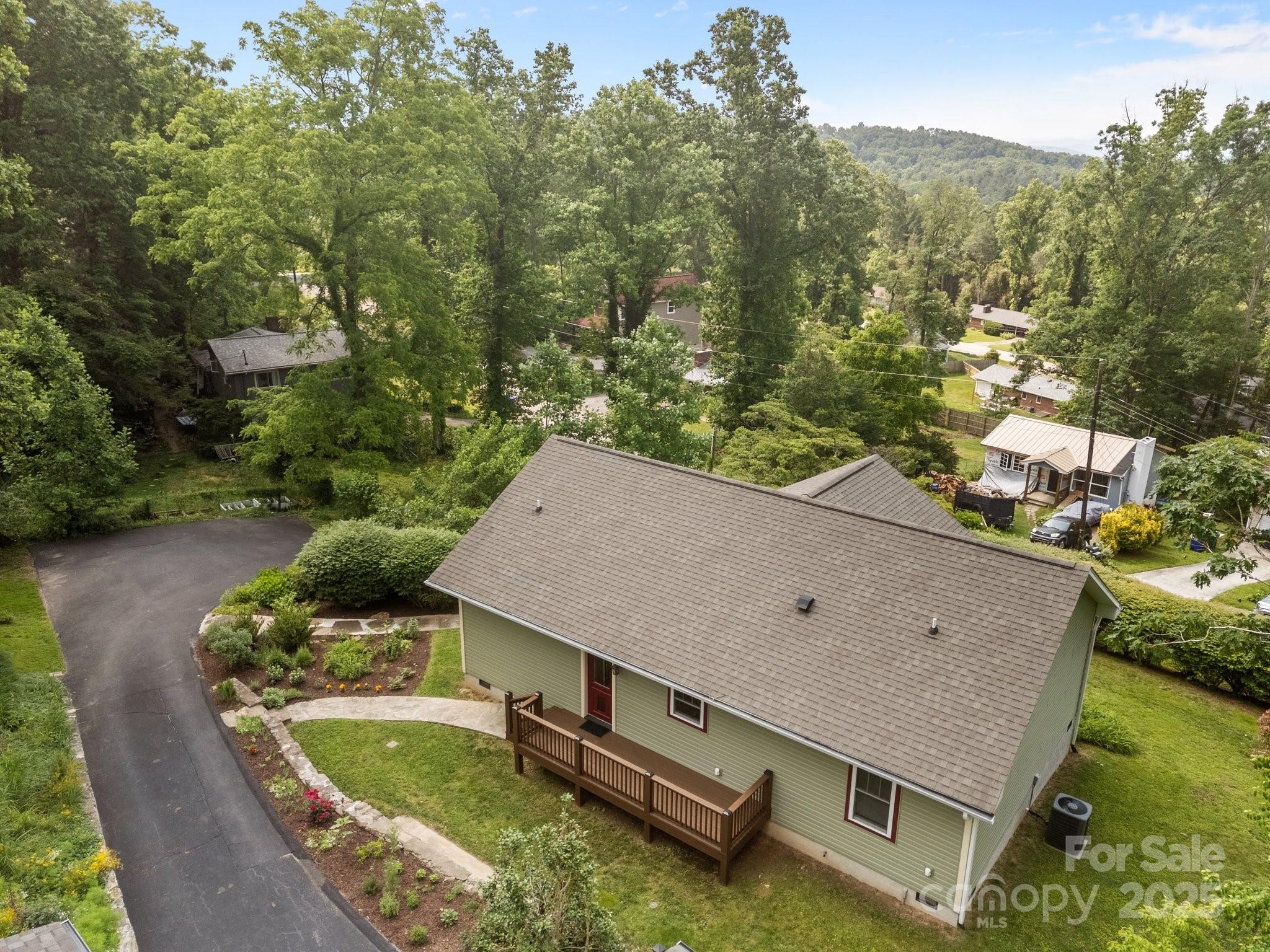 17 Laurel Road Arden, NC 28704 - Photo 33 of 45 an aerial view of a house with swimming pool and a yard