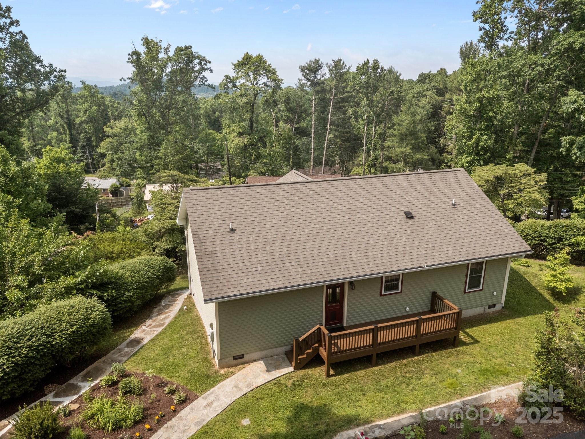 17 Laurel Road Arden, NC 28704 - Photo 34 of 45 an aerial view of a house with a yard table and chairs