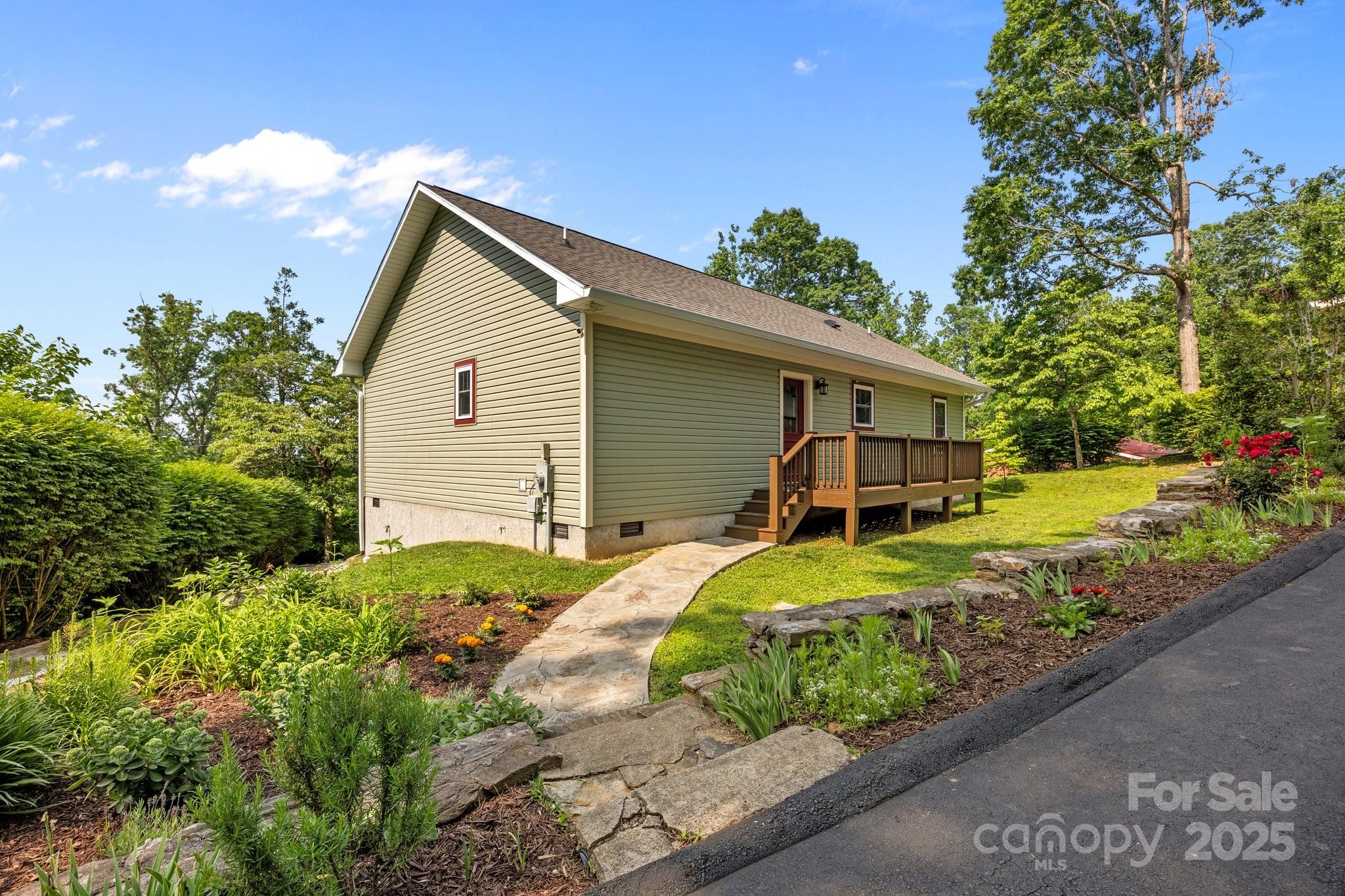 17 Laurel Road Arden, NC 28704 - Photo 35 of 45 a front view of house with yard and trees around