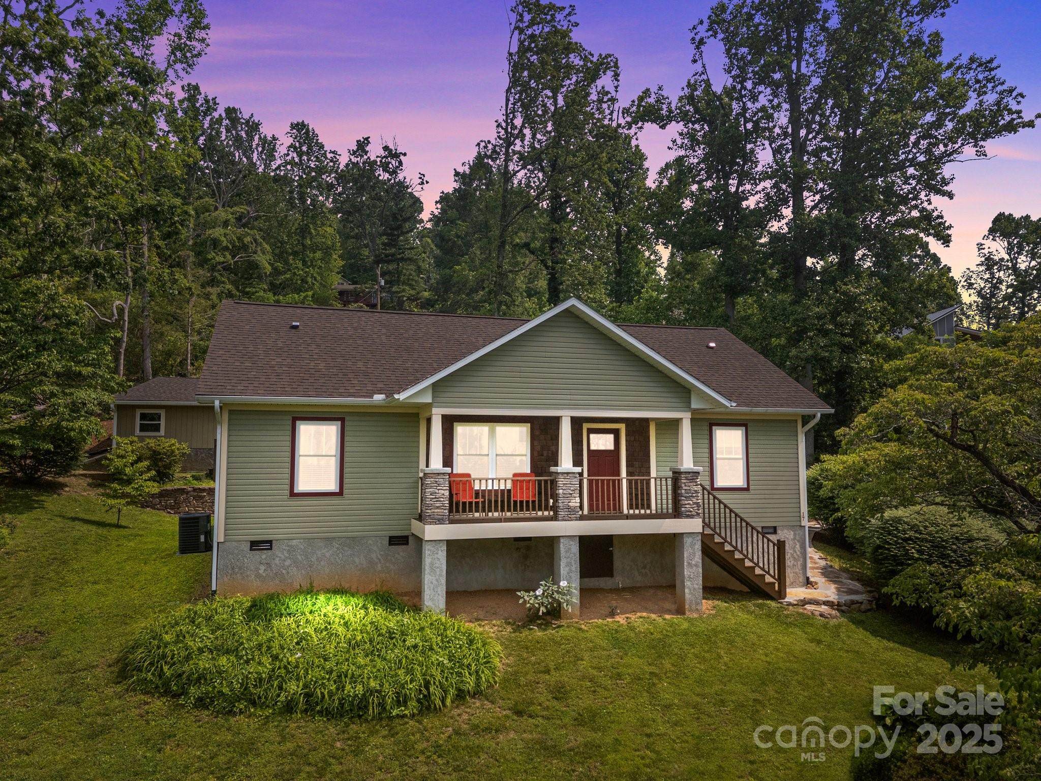 17 Laurel Road Arden, NC 28704 - Photo 45 of 45 a front view of a house with a garden and trees