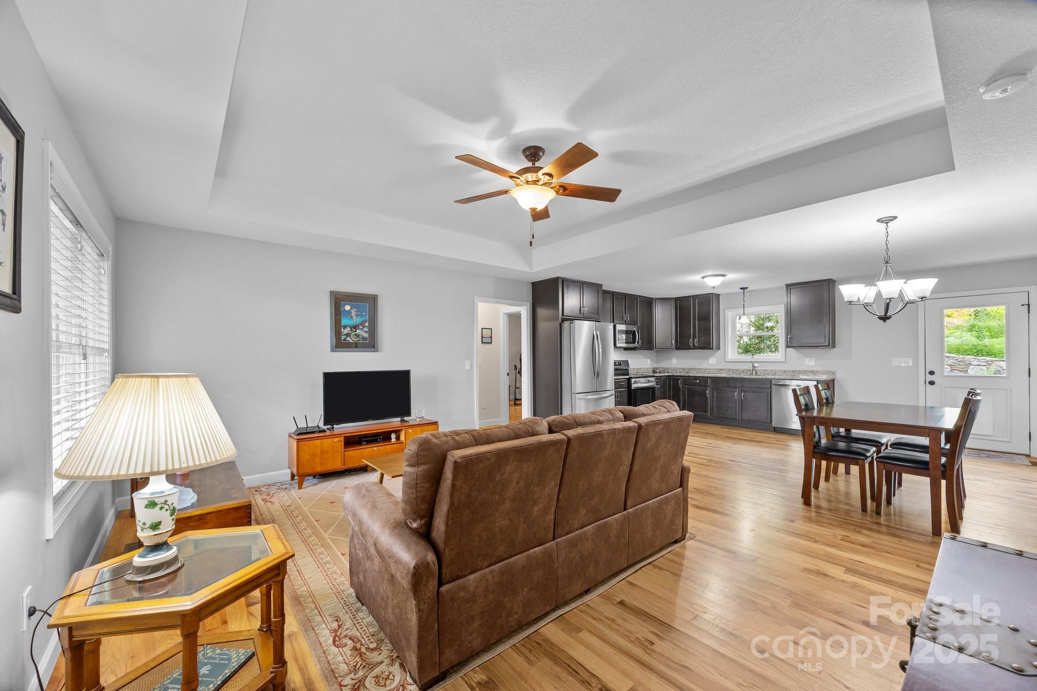 17 Laurel Road Arden, NC 28704 - Photo 5 of 45 a living room with furniture a table and a fireplace