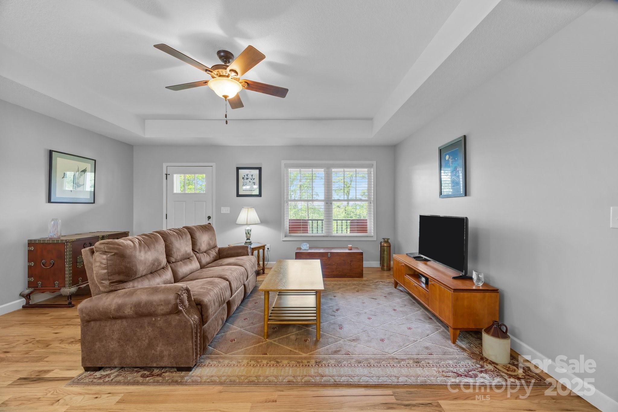 17 Laurel Road Arden, NC 28704 - Photo 6 of 45 a living room with furniture and a flat screen tv