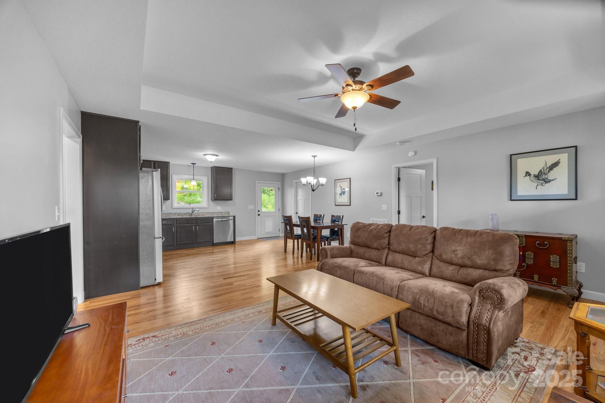 17 Laurel Road Arden, NC 28704 - Photo 7 of 45 a living room with furniture a ceiling fan and a rug