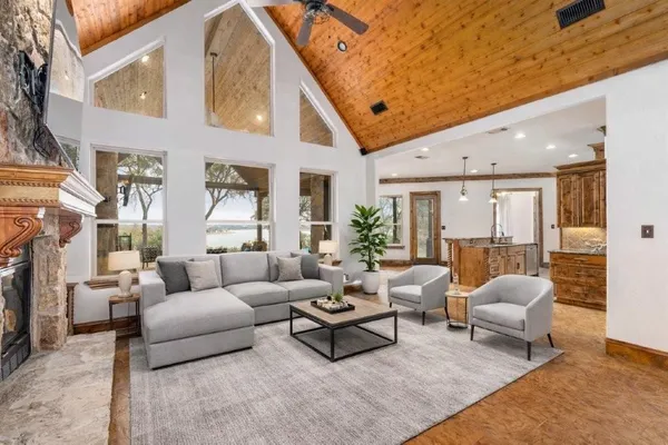 a living room with furniture fireplace and a flat screen tv