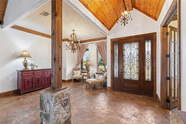 a living room with fireplace furniture and a flat screen tv