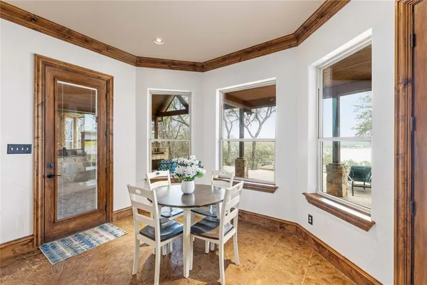 a dining room with furniture and window